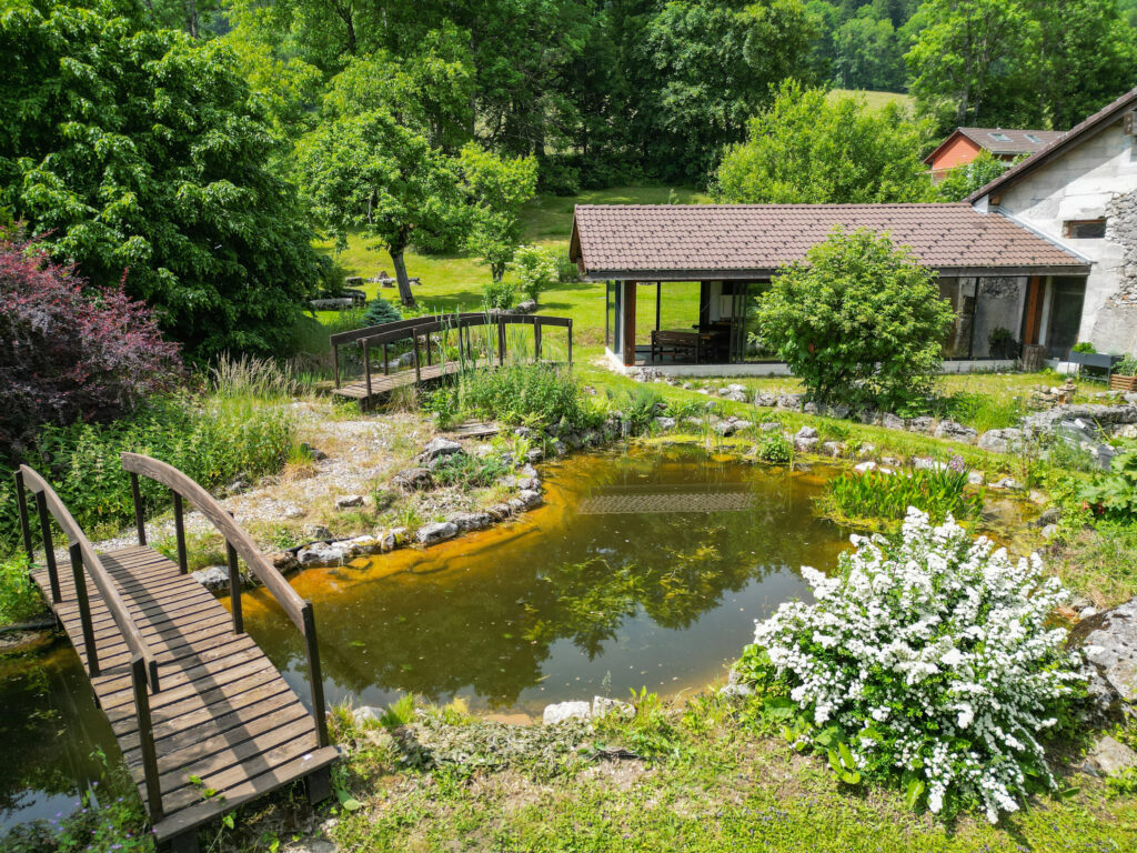 Renovated semi-detached farmhouse with living quarters, a barn, and building lot